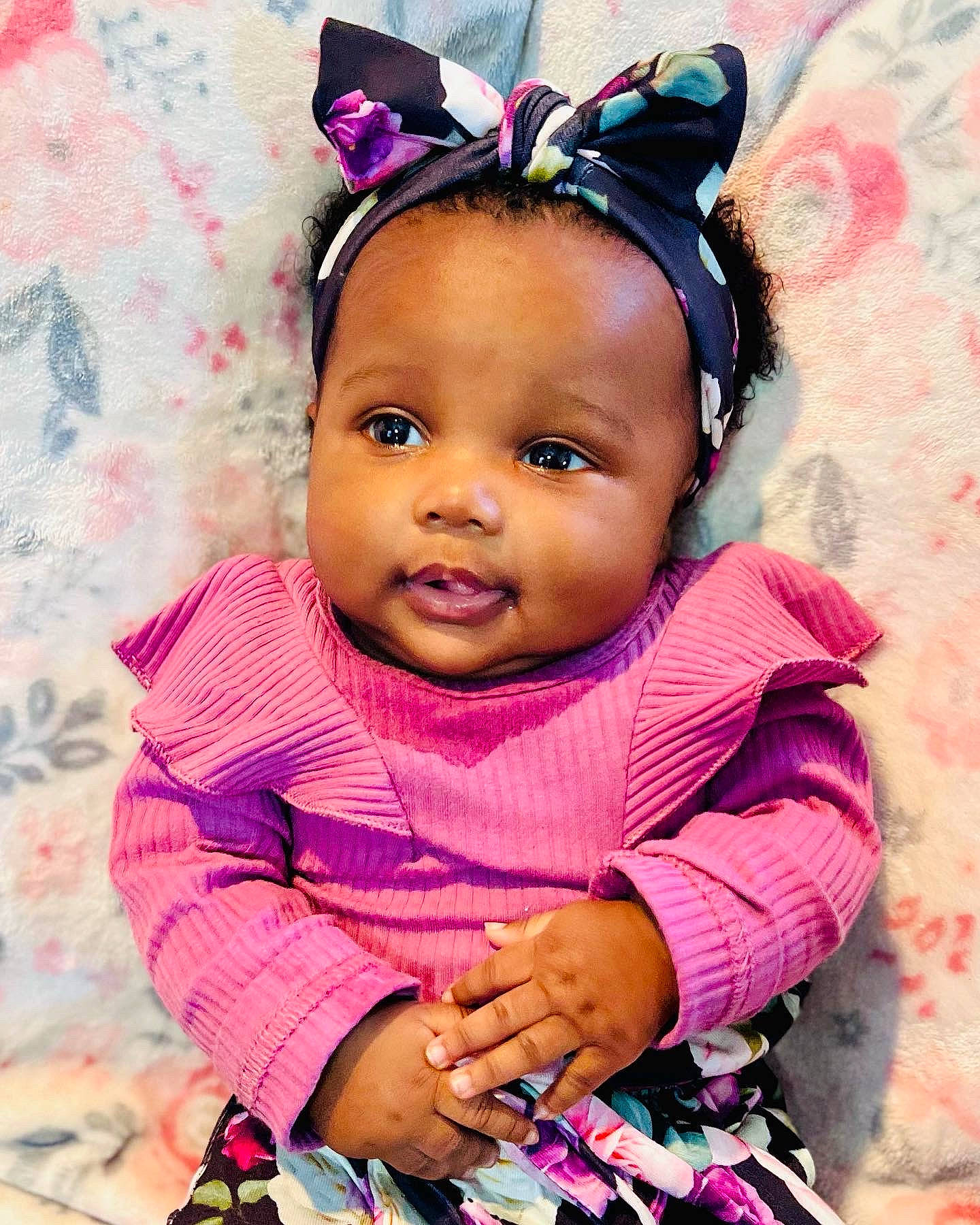 Anaya is registered to the contest to win money with this photo: baby_toddler_clothing, cheek, clothing, dress, eyelash, hair, happy, headgear, human_body, iris, magenta, person, photograph, pink, purple, skin, sleeve, smile, textile, toddler