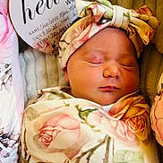 Charlotte is registered to the contest to win money with this photo: newborn, baby, sleeping, floral, blanket, headband, infant, portrait, closeup, soft, cozy, cute, child, wrapped, peaceful, indoors, person, flower, resting, warm