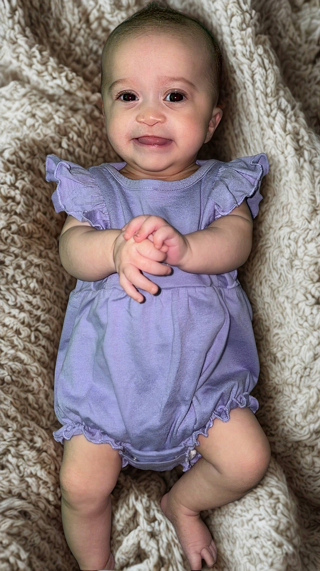 Jream joined the competition — help win amazing prizes! adorable, baby, child, cozy, cute, expression, face, hands_clasped, head, indoors, infant, knitted_blanket, legs, lying_down, portrait, purple_clothing, romper, skin, smiling, soft_texture