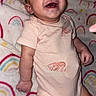 baby, infant, smile, laugh, onesie, blanket, rainbow_pattern, cute, happy, child, lying_down, skin, face, head, clothing, footwear, indoors, person, baby_girl, soft_toys