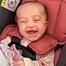 baby, infant, smiling, laughing, car_seat, pacifier, pink, blanket, clothing, child, cute, happy, face, head, seatbelt, comfort, indoor, toddler, bundle, joy