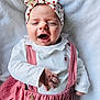Mélyanah participe au concours pour gagner de l'argent avec cette photo : baby, child, headband, bow, pink_overalls, white_shirt, blanket, yawning, lying_down, soft_texture, cute, infant, small_hand, closed_eyes, indoors, comfortable, portrait, adorable, clothing, baby_fashion