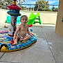 Eyden participe au concours pour gagner de l'argent avec cette photo : toddler, child, baby, inflatable_pool, water, toy, slide, outdoor, patio, wet, play, summer, sunny, floor, expression, sitting, plastic, colorful, fun, daytime