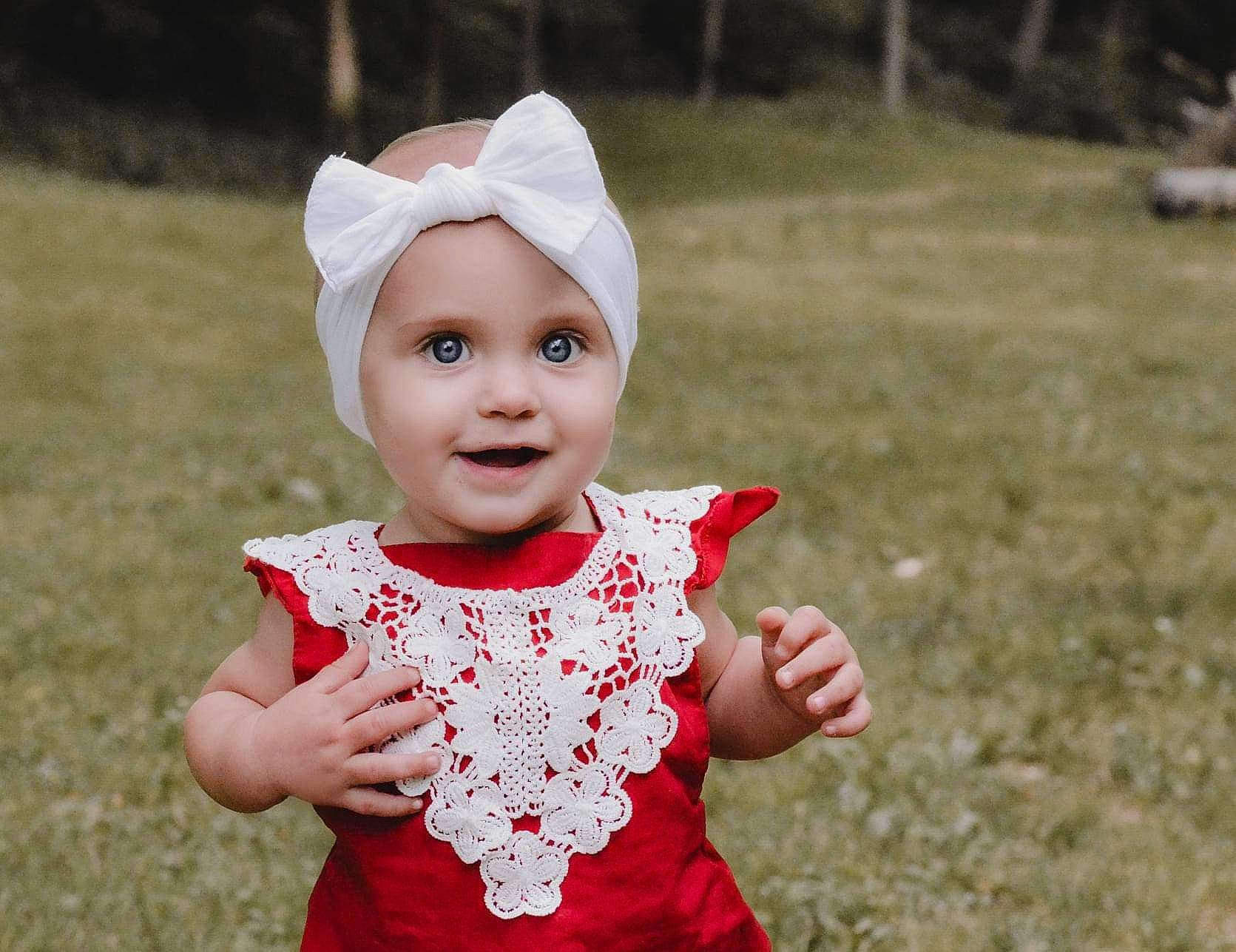 Hensley joined the competition — help win amazing prizes! baby, baby_toddler_clothing, cap, child, costume_hat, face, fashion_accessory, flash_photography, fun, gesture, grass, happy, headwear, joy, lip, pattern, people, people_in_nature, person, portrait_photography