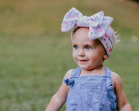 Hensley joined the competition — help win amazing prizes! baby, baby_toddler_clothing, cap, child, costume_hat, facial_expression, fun, grass, grassland, hair_accessory, happy, hat, headband, headpiece, headwear, joy, meadow, people_in_nature, person, plant