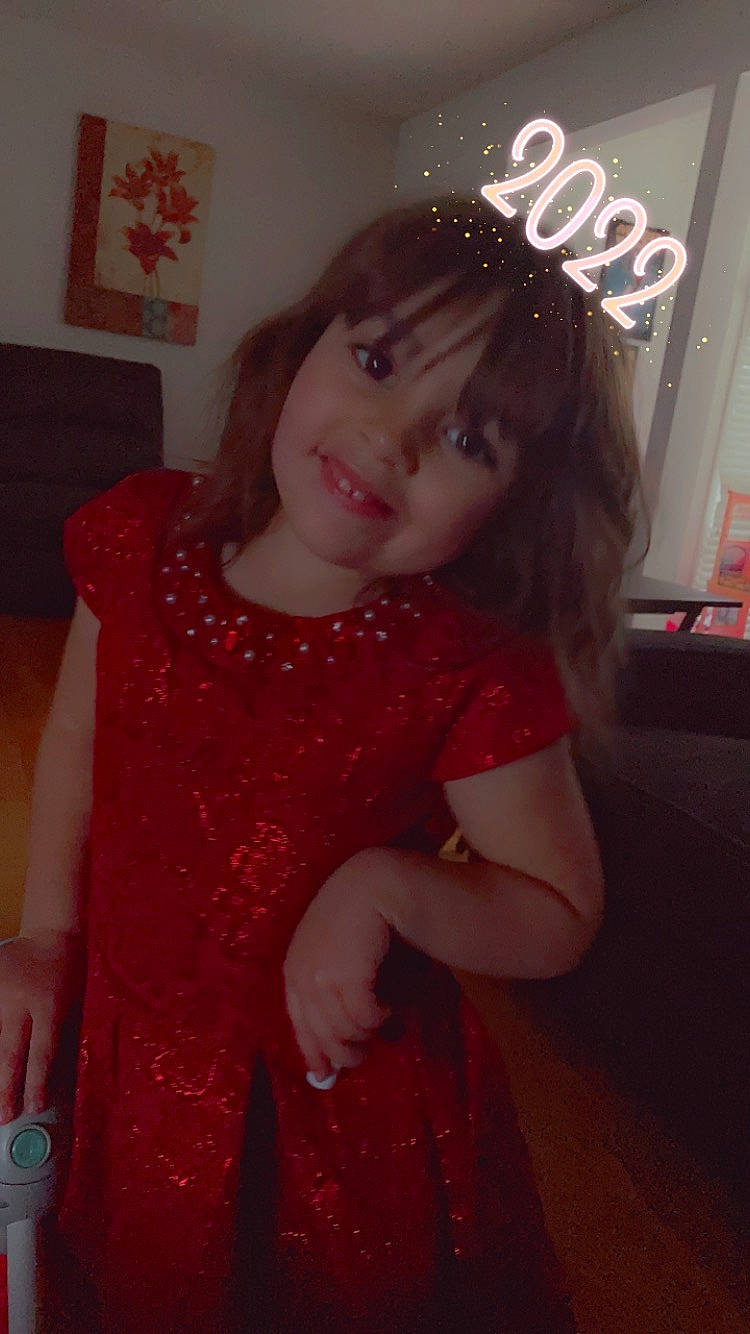 Rosemary is registered to the contest to win money with this photo: baby_toddler_clothing, day_dress, dress, embellishment, event, fun, happy, head, iris, joy, lip, long_hair, magenta, one_piece_garment, pattern, person, pink, skin, sleeve, smile