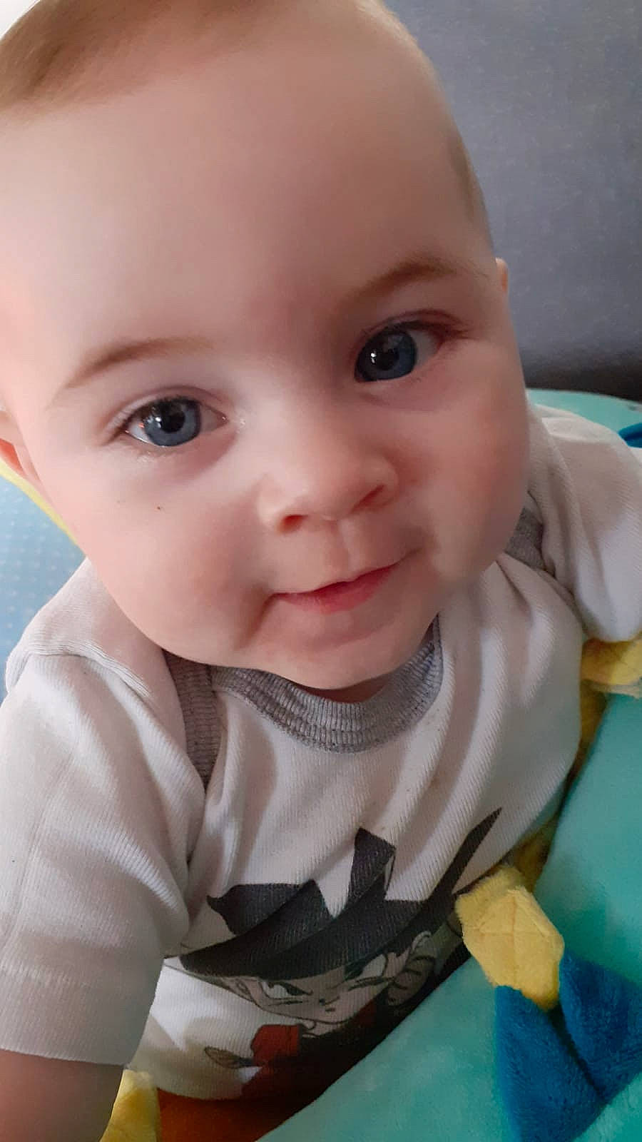 Gabriel participe au concours pour gagner de l'argent avec cette photo : baby, baby_products, baby_toddler_clothing, cheek, child, chin, eyebrow, eyelash, flooring, grass, happy, iris, lip, mouth, nose, person, sitting, skin, sleeve, toddler