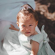 Michelle joined the competition — help win amazing prizes! toddler, child, dress, blue_dress, pearl_detail, hair_clip, sunlight, outdoor, portrait, cute, baby, person, smile, face, young_child, soft_light, curious, expression, skin, arm