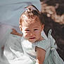 toddler, child, dress, blue_dress, pearl_detail, hair_clip, sunlight, outdoor, portrait, cute, baby, person, smile, face, young_child, soft_light, curious, expression, skin, arm