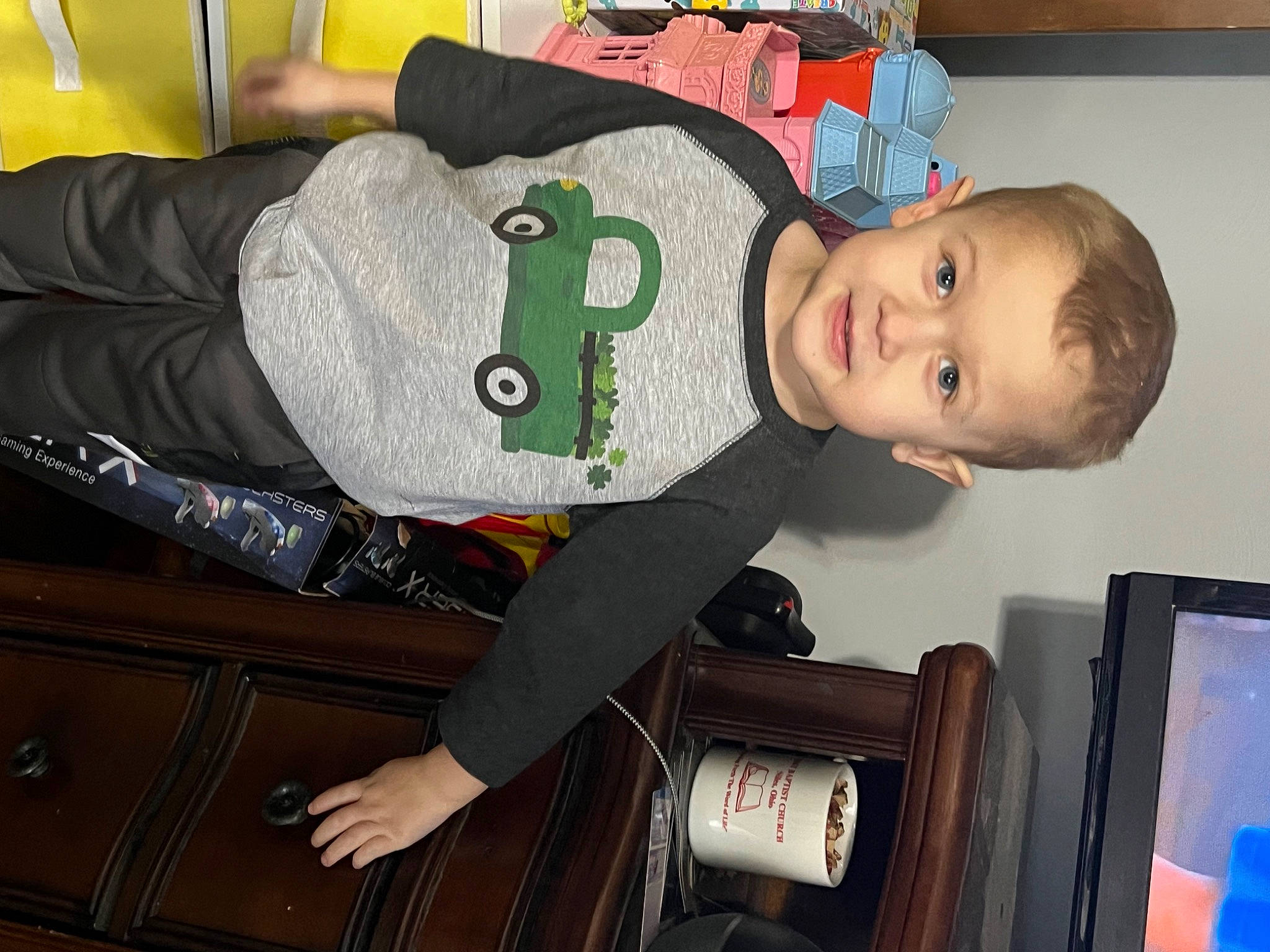 Xavier is registered to the contest to win money with this photo: baby, baby_products, baby_toddler_clothing, child, comfort, fun, happy, lap, person, room, sitting, smile, toddler