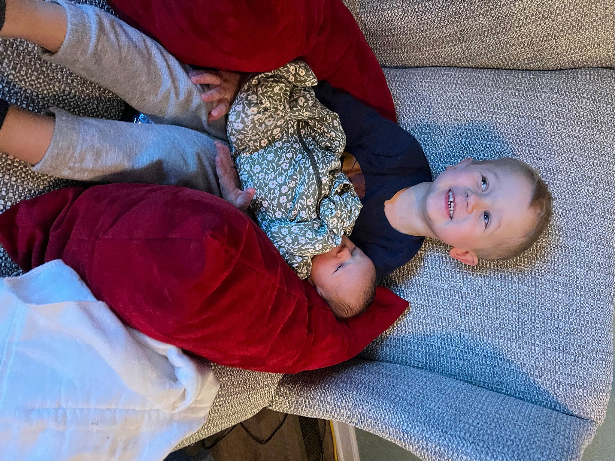 Xavier joined the competition — help win amazing prizes! baby, baby_toddler_clothing, child, comfort, electric_blue, flooring, fun, grass, human_leg, joy, lap, linens, mouth, nap, pattern, person, sitting, sleep, textile, thigh