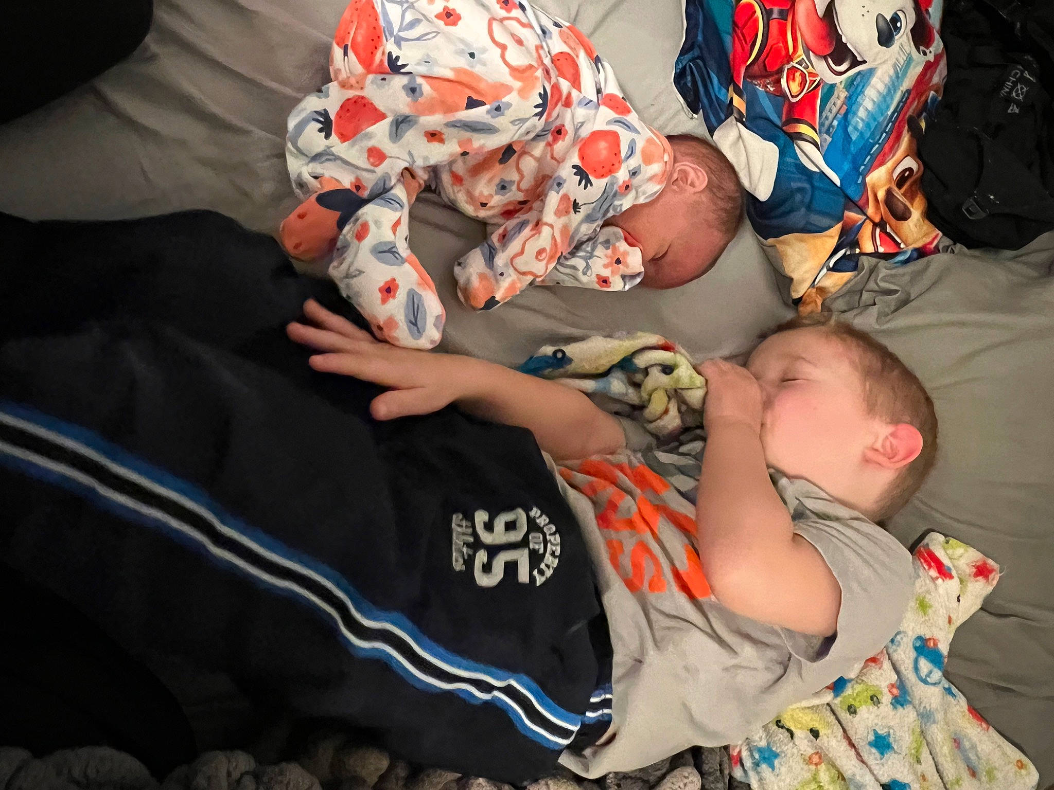 Xavier is registered to the contest to win money with this photo: baby, baby_products, child, comfort, couch, elbow, finger, fun, hand, human_leg, joint, lap, linens, pattern, person, sitting, t_shirt, textile, thigh, toddler