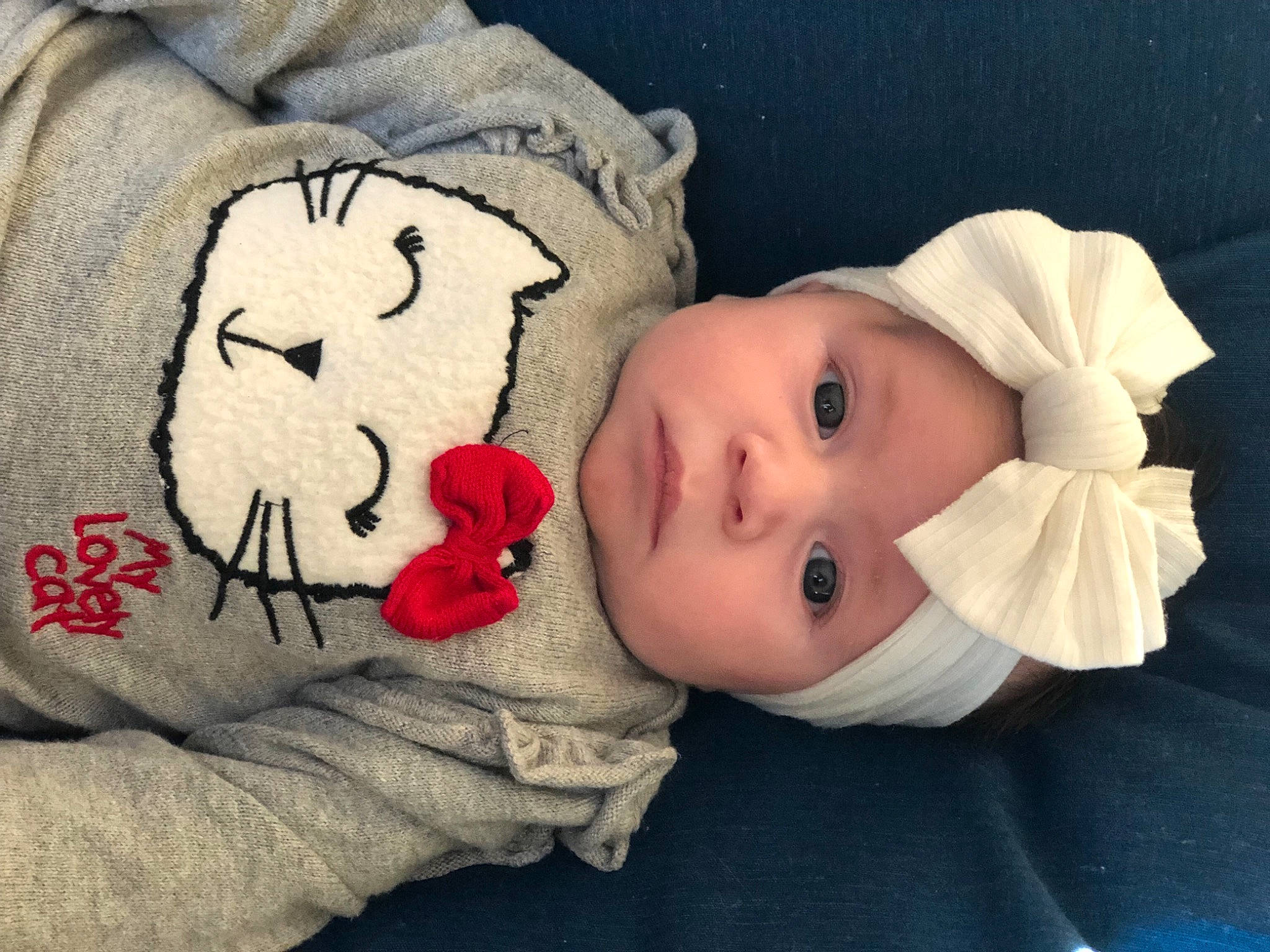 Hanaë participe au concours pour gagner de l'argent avec cette photo : baby, baby_toddler_clothing, cheek, comfort, eye, eyelash, hat, head, headgear, headwear, human, linens, lip, mouth, nose, person, pink, product, skin, sleeve