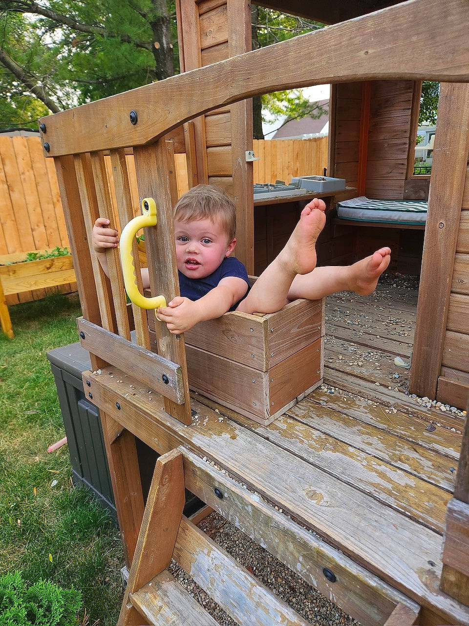 Joah is registered to the contest to win money with this photo: baby, baby_safety, baby_toddler_clothing, child, comfort, fun, grass, hardwood, leisure, outdoor_furniture, outdoor_play_equipment, person, play, recreation, shorts, sitting, toddler, tree, vacation, wood