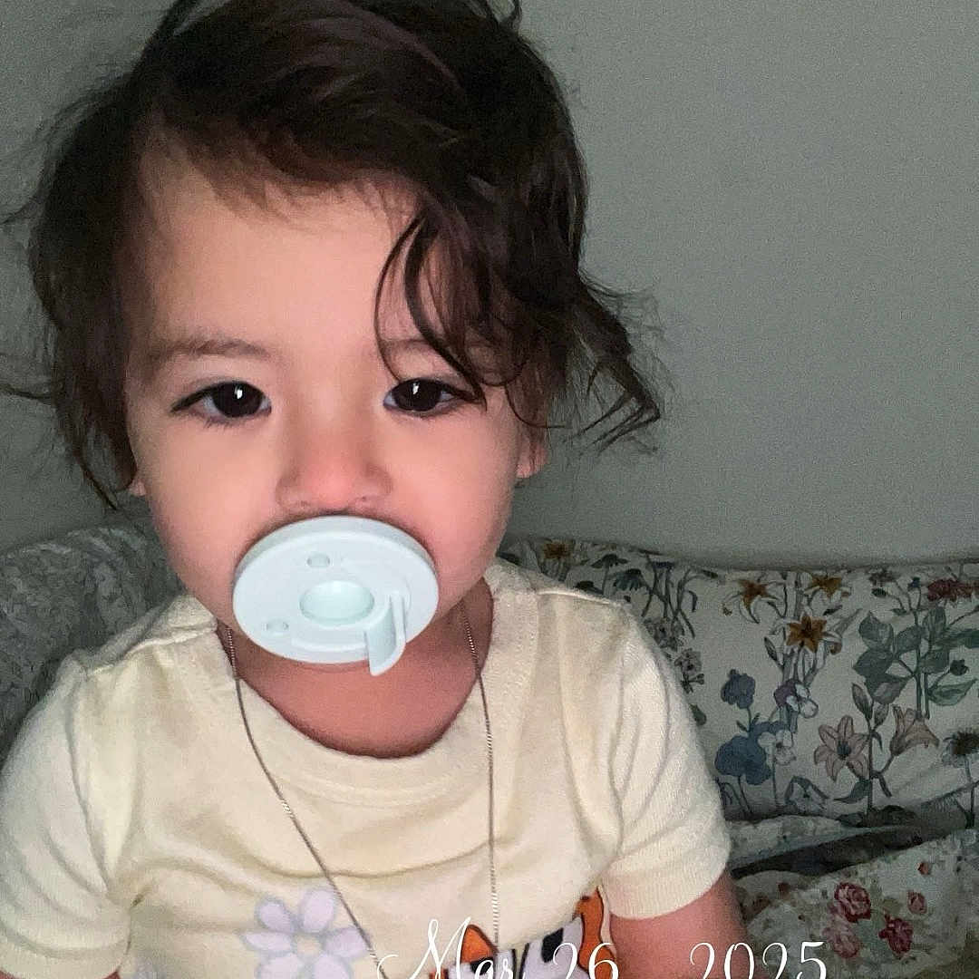 Joelissa is registered to the contest to win money with this photo: accessories, architecture, baby, clothing, couch, cushion, earring, electronics, face, furniture, head, homedecor, indoors, jewelry, necklace, person, photography, portrait, sitting, t_shirt