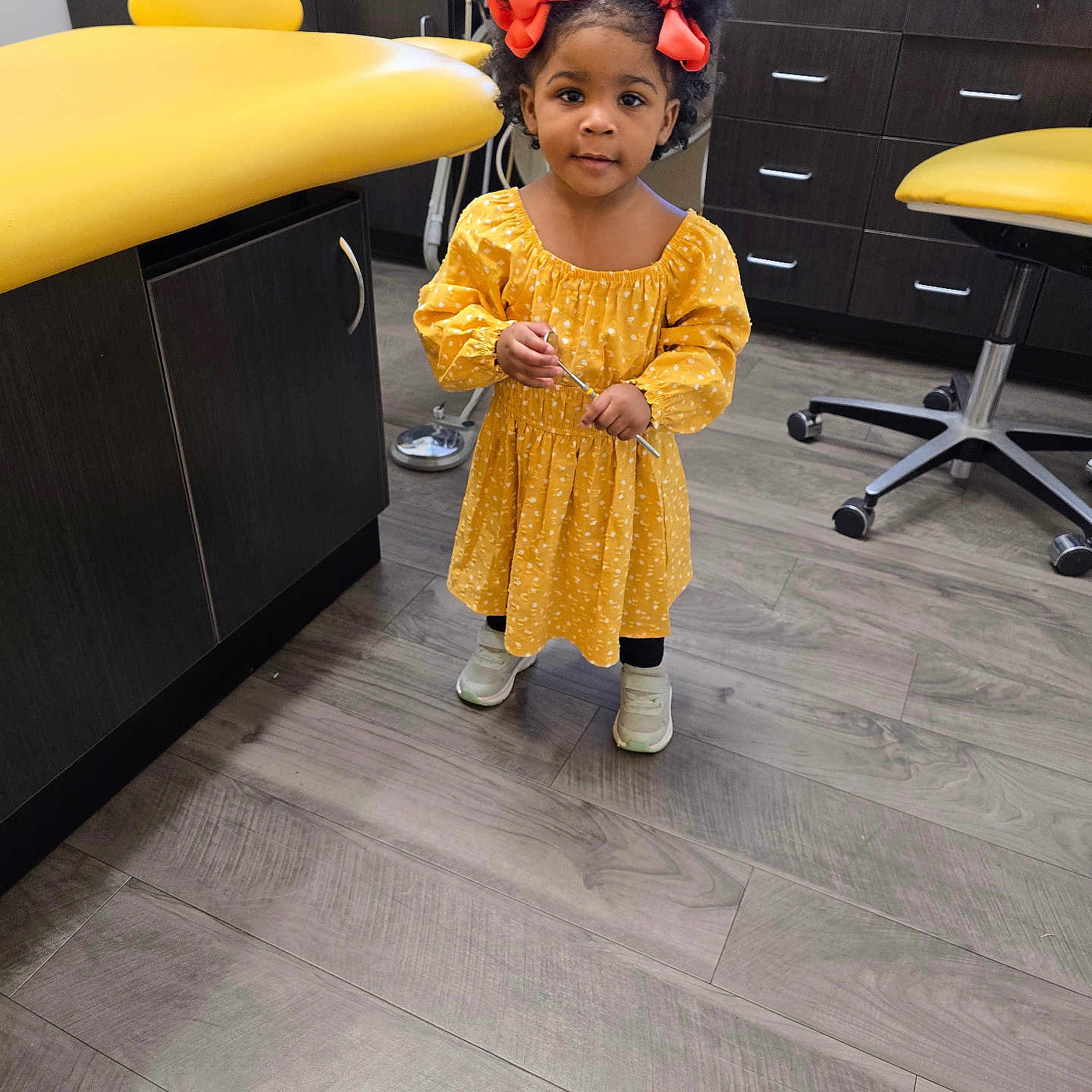 Justice is registered to the contest to win money with this photo: chair, child, clothing, desk, dress, face, female, footwear, furniture, girl, hardwood, head, indoors, interiordesign, person, photography, portrait, shoe, table, wood