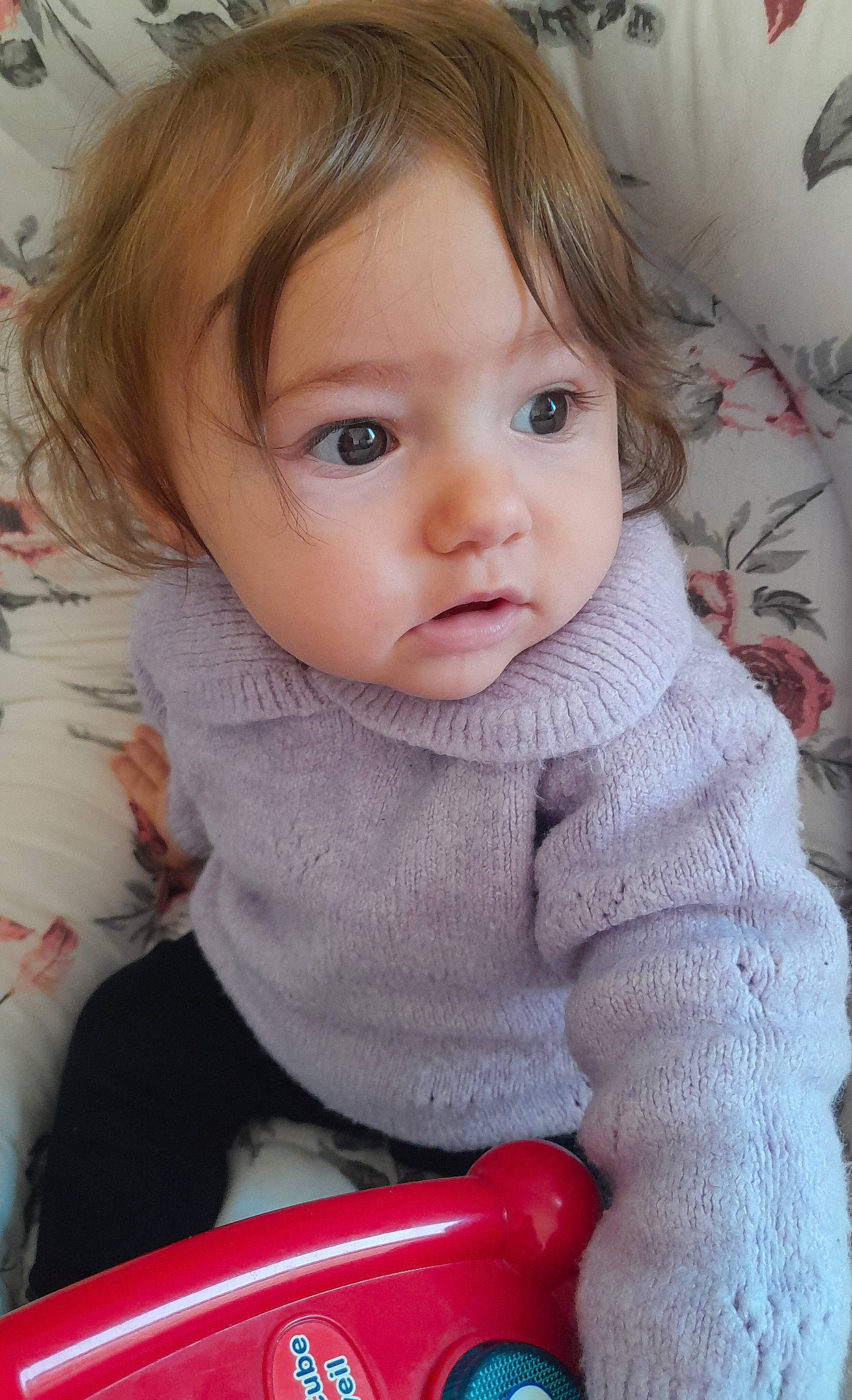 Nayline participe au concours pour gagner de l'argent avec cette photo : baby, baby_toddler_clothing, cheek, child, clothing, eyelash, flooring, iris, lip, nose, outerwear, pattern, person, pink, product, sitting, skin, sleeve, toddler, wool