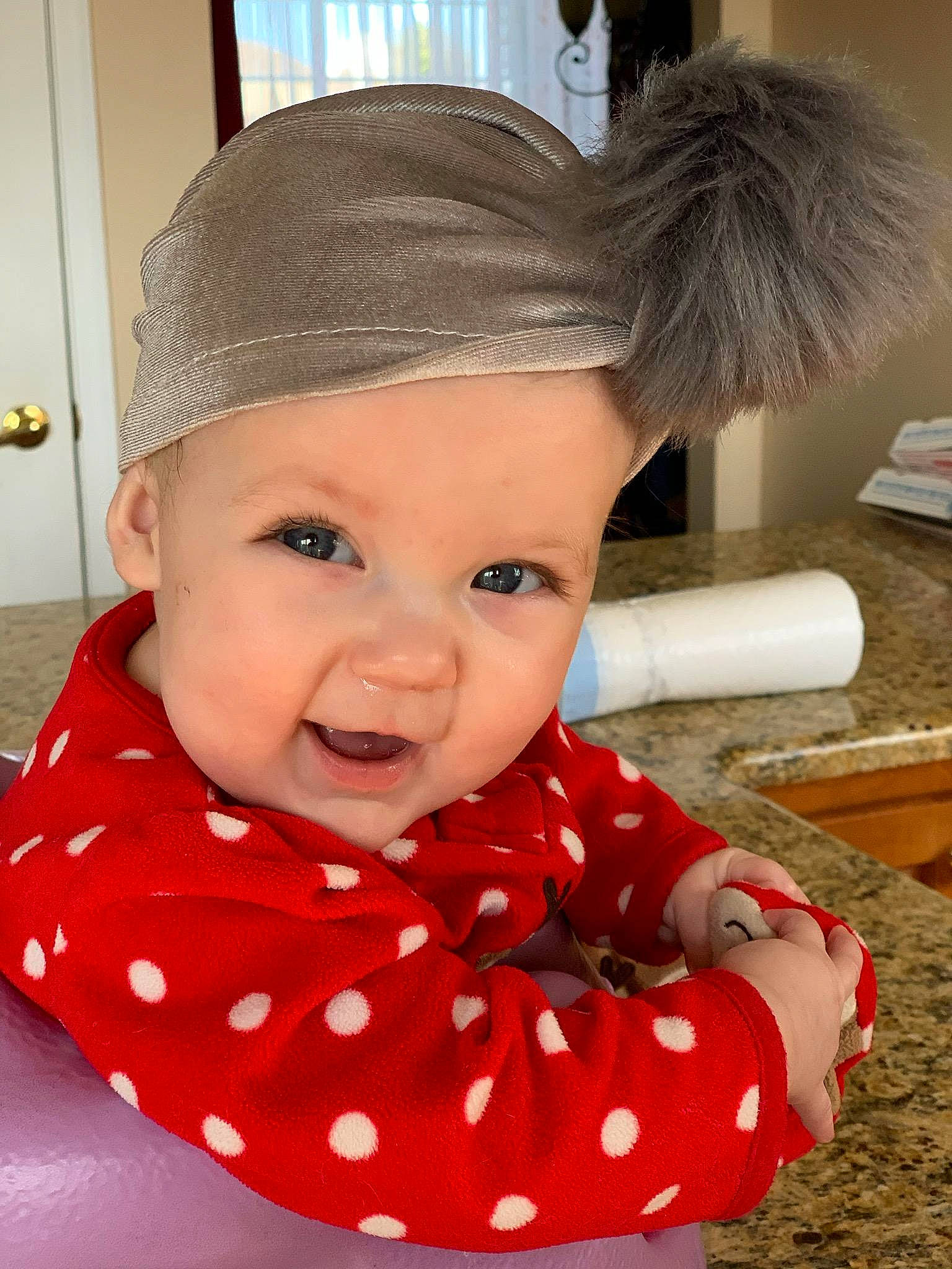 Giavanna is registered to the contest to win money with this photo: baby, cheek, child, design, ear, face, forehead, head, headgear, headwear, lip, neck, nose, outerwear, pattern, person, polka_dot, skin, smile, toddler