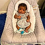 baby, clothing, crib, face, furniture, head, hosiery, infantbed, person, sock