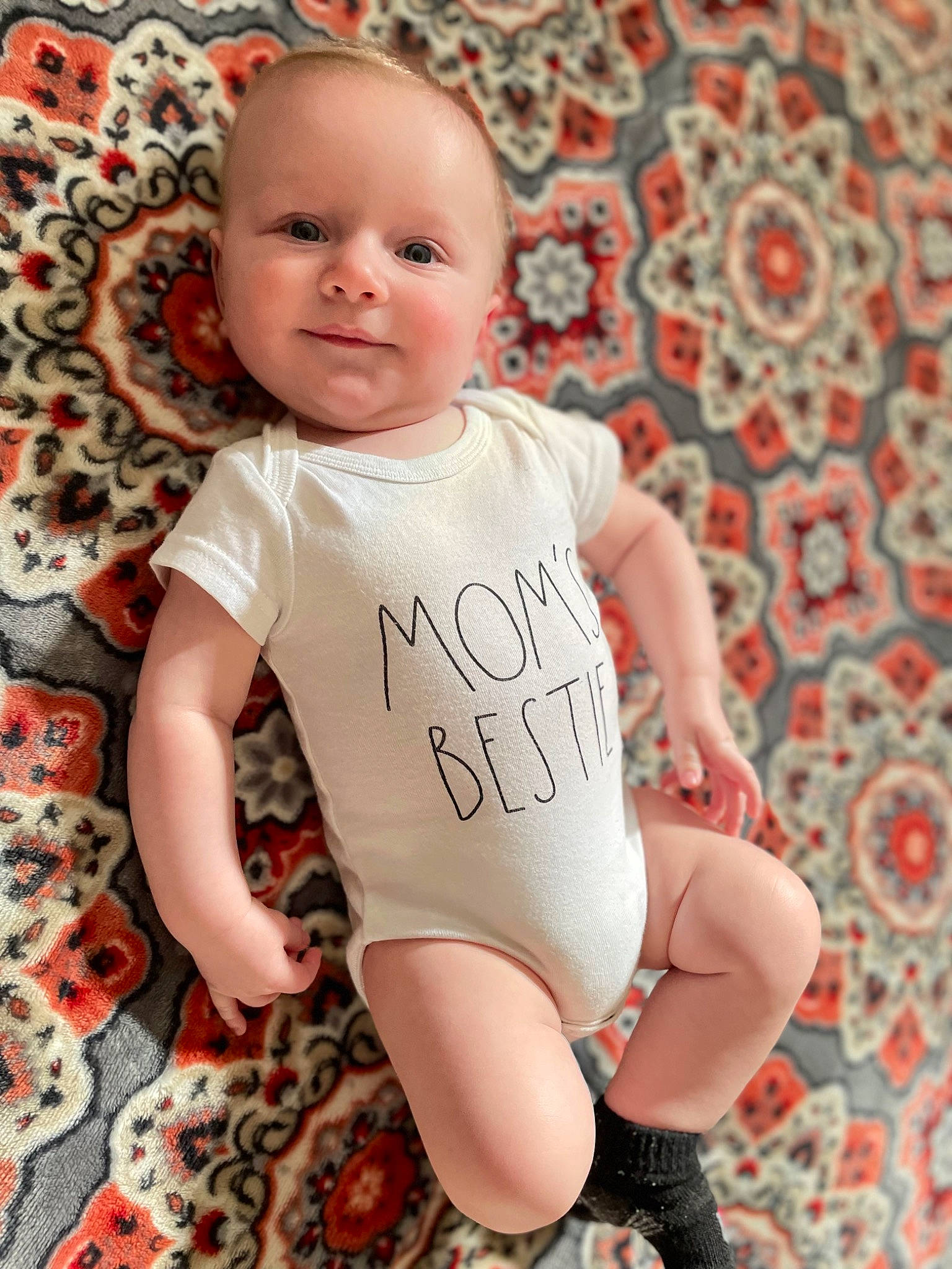 Brycen is registered to the contest to win money with this photo: baby, baby_toddler_clothing, cheek, comfort, finger, happy, head, knee, leg, muscle, neck, orange, person, pink, skin, sleeve, smile, stomach, textile, thigh