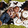 Ezekiel joined the competition — help win amazing prizes! baby, infant, cowhide_blanket, jeans, shirt, rope, cake, birthday_cake, celebration, two_months, footwear, brown_shoes, decorated_cake, indoor, portrait, cute, child, smiling, lying_down, cowboy_theme