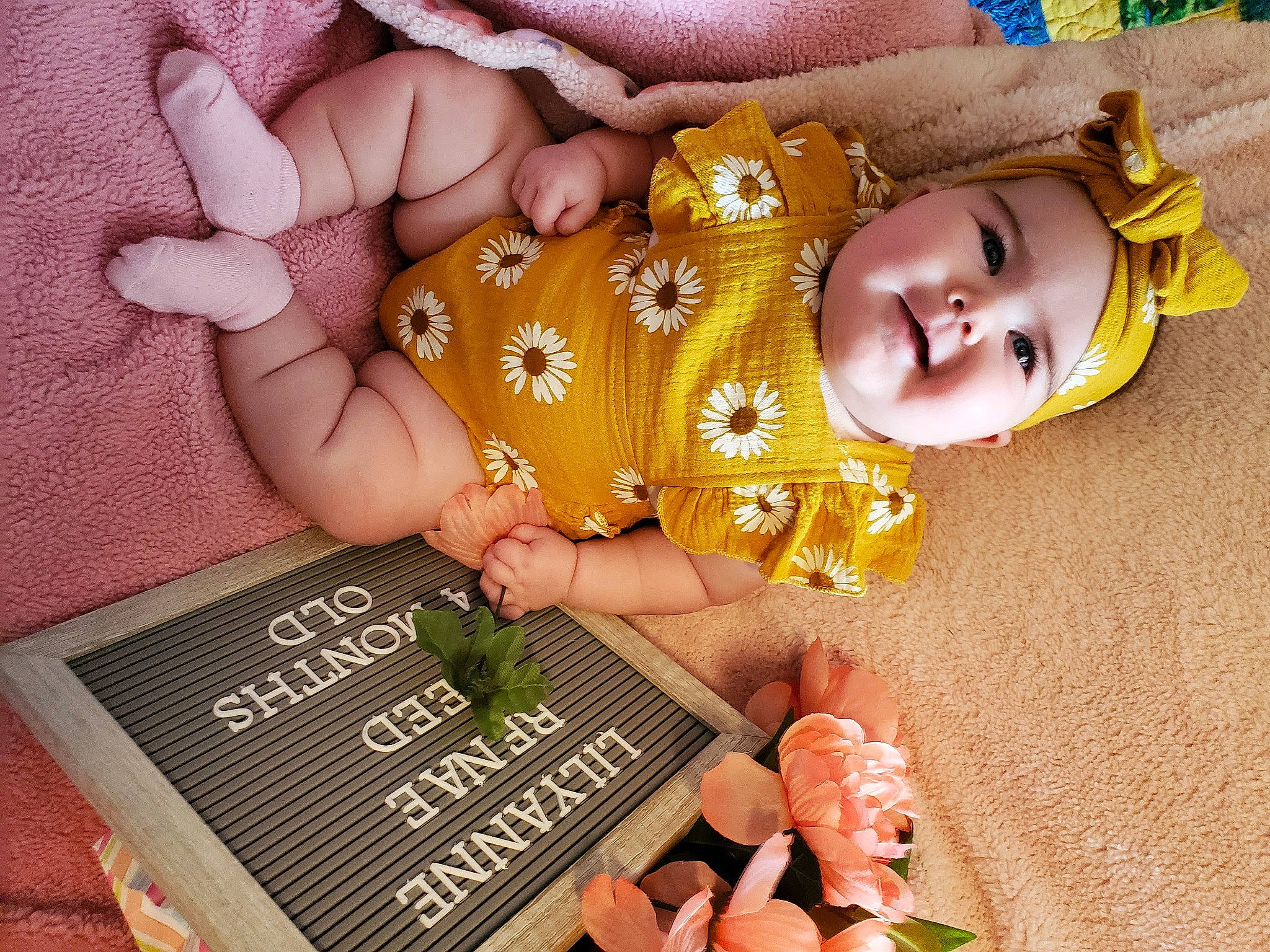 Lilyanne joined the competition — help win amazing prizes! baby, baby_toddler_clothing, cheek, child, finger, font, gesture, grass, hand, happy, headwear, nail, natural_foods, peach, people_in_nature, person, petal, skin, smile, soil