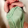 baby, bath, bubble_bath, towel, water, foam, infant, skin, relaxing, sitting, bathtub, child, screenshot, social_media, mobile_screen, emoji, interface, cute, small, indoors