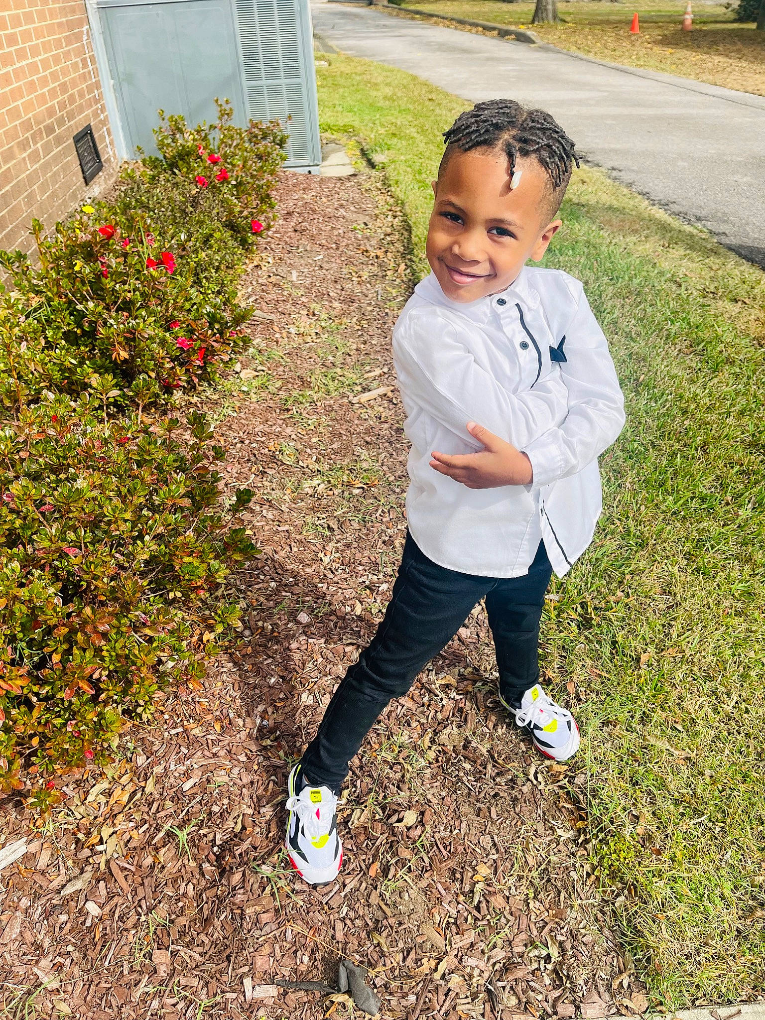 Prince is registered to the contest to win money with this photo: annual_plant, ball, child, flower, football, fun, grass, grass_family, happy, joy, lawn, leisure, people_in_nature, person, plant, shoe, smile, sneakers, soccer, soil