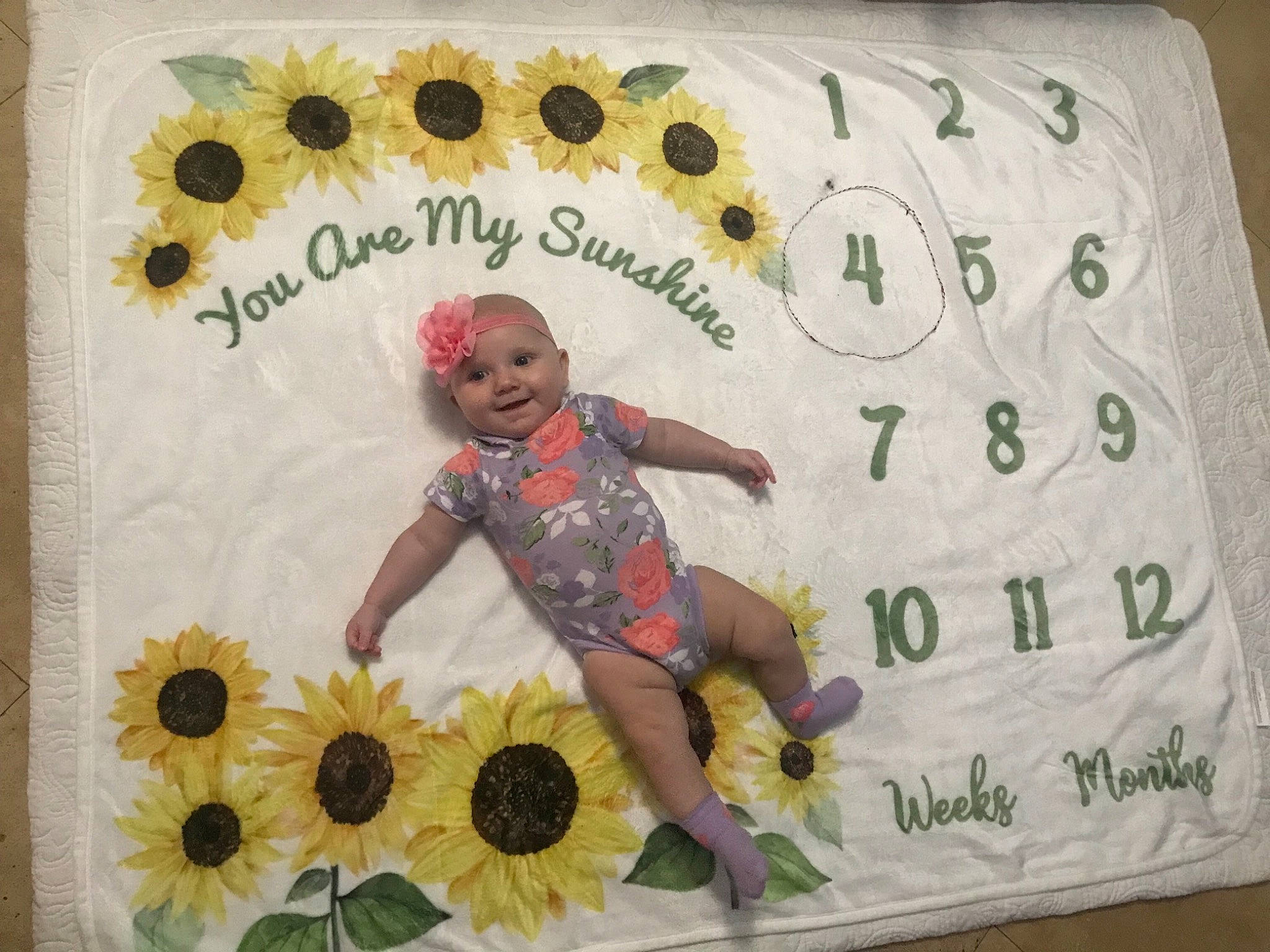Alyee is registered to the contest to win money with this photo: art, baby_toddler_clothing, circle, event, floral_design, flower, font, happy, headwear, joy, linens, paper, pattern, person, petal, plant, rectangle, room, sleeve, smile