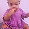adorable, baby, bows, child, curly_hair, cute, finger_in_mouth, girl, indoor, infant, innocence, pacifier, playful, plush_toy, portrait, purple_dress, sitting, soft_surface, toddler, young_child