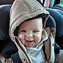 baby, child, car_seat, hooded_jacket, smile, happy, infant, seatbelt, clothing, person, portrait, cute, indoor, car_interior, young_child, warm_clothing, face, headwear, jacket, seat