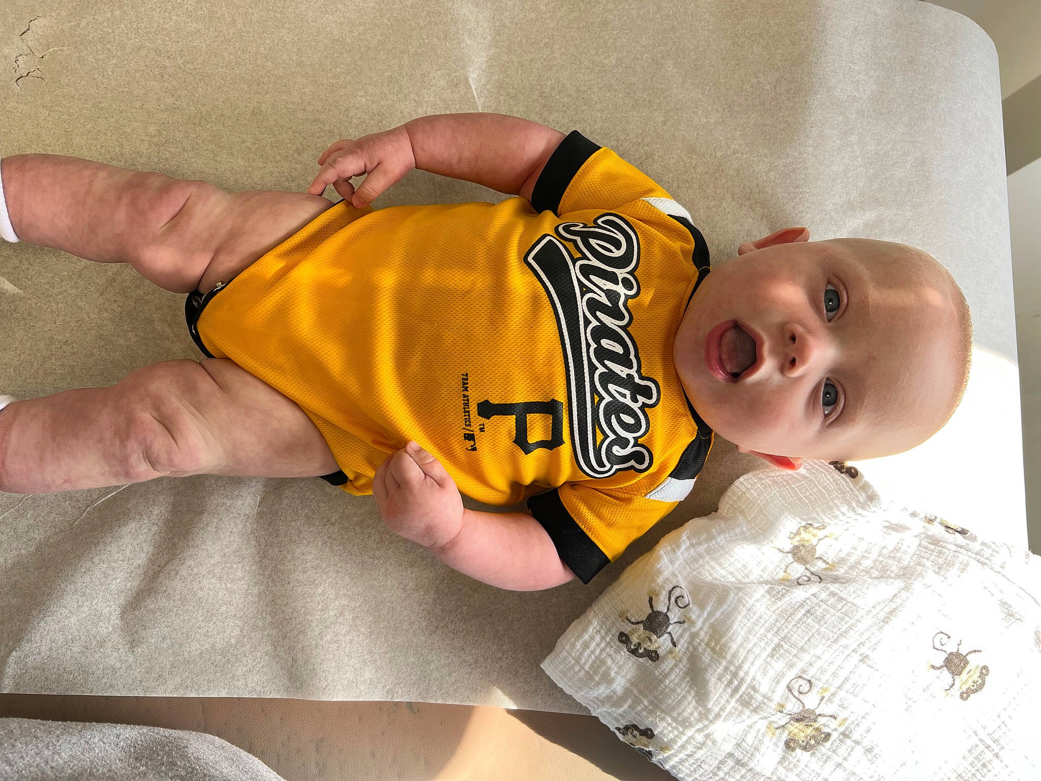 Payton is registered to the contest to win money with this photo: baby, baby_products, baby_safety, baby_toddler_clothing, child, comfort, elbow, eye, finger, foot, hand, happy, linens, pattern, person, room, sleeve, smile, surprise, t_shirt