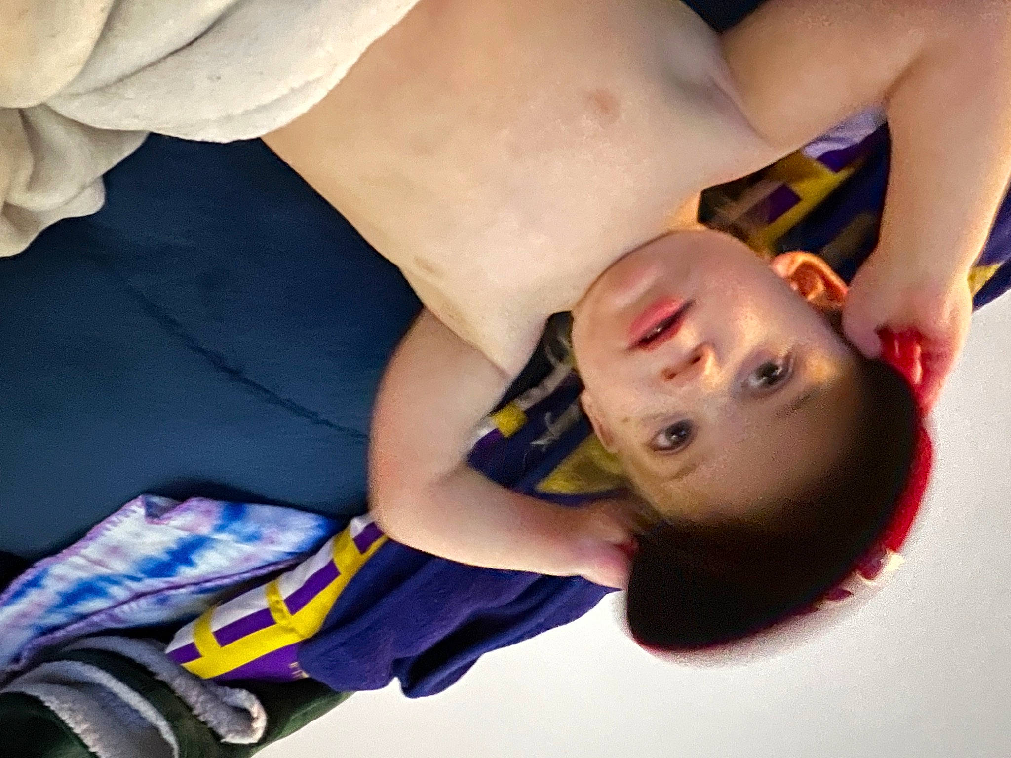 Alexander is registered to the contest to win money with this photo: abdomen, baby, chest, elbow, eye, eyelash, finger, flash_photography, gesture, hand, happy, human_body, human_leg, mouth, person, skin, thigh, tire, toddler, trunk