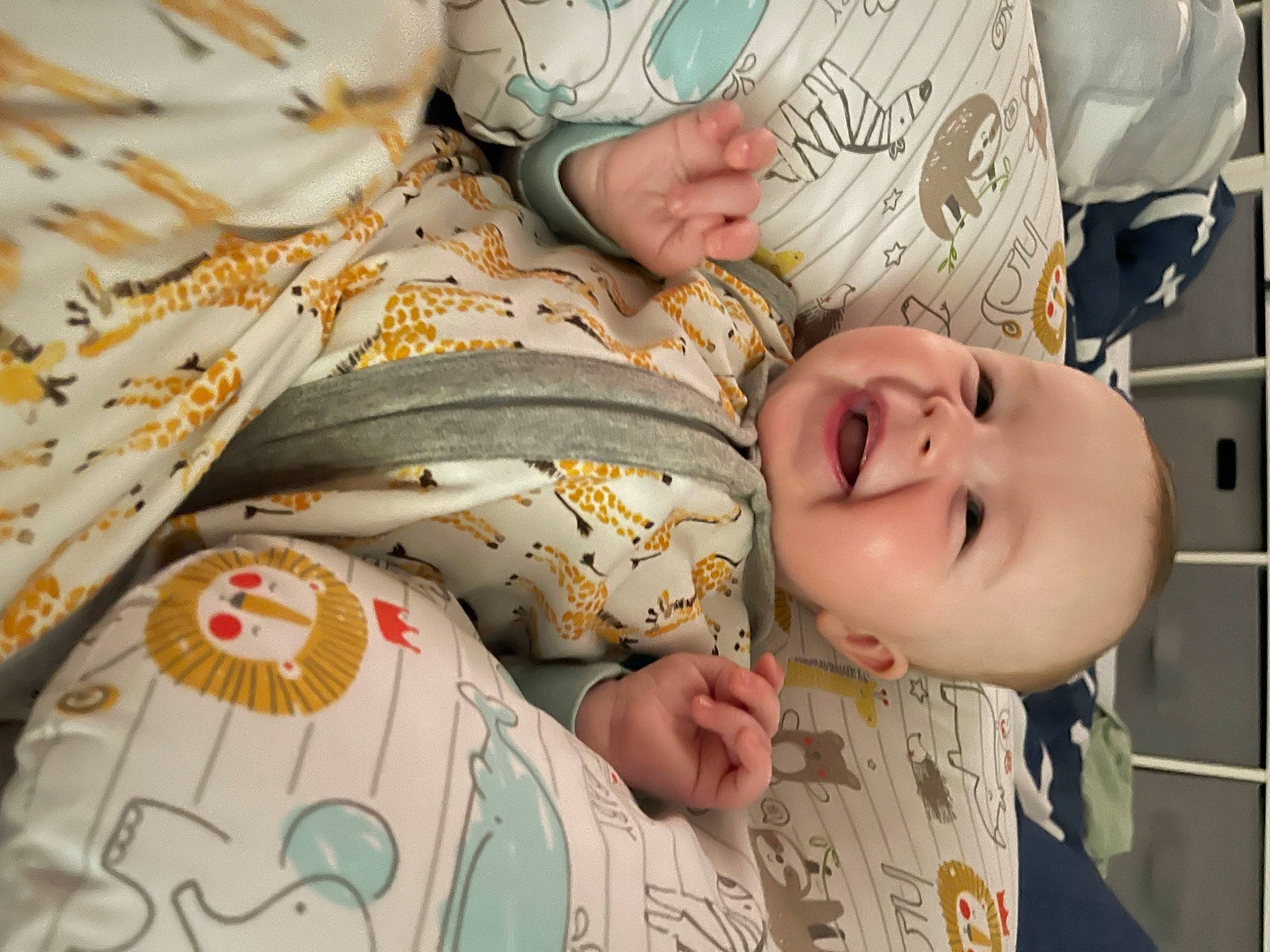 Reid is registered to the contest to win money with this photo: baby, baby_toddler_clothing, child, comfort, eye, face, hair, happy, head, human_body, linens, nose, pattern, person, product, skin, smile, textile, toddler, white