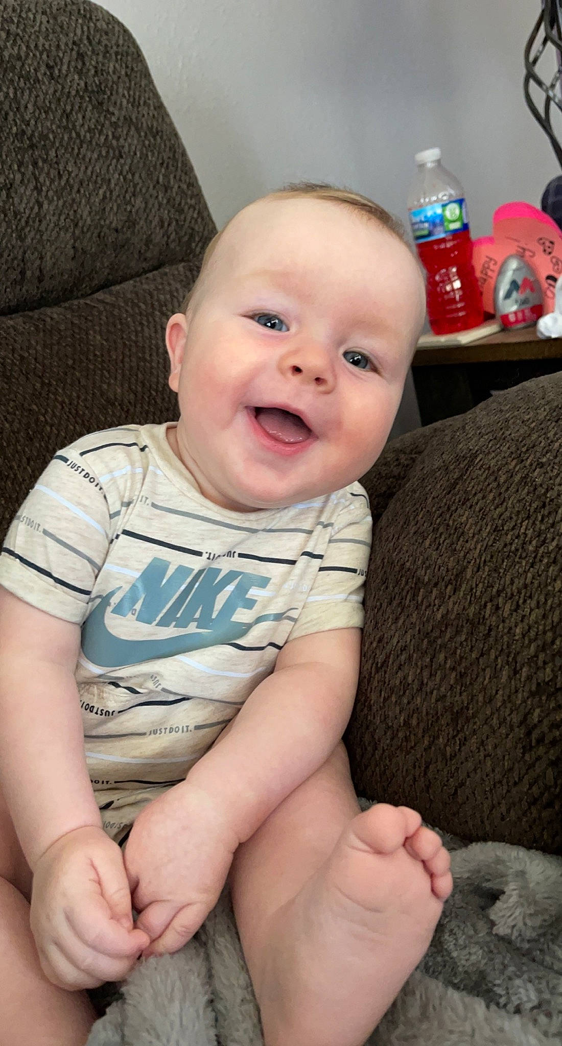 Reid joined the competition — help win amazing prizes! baby, baby_toddler_clothing, bottle, cheek, child, comfort, eye, finger, happy, head, knee, leg, mammal, mouth, person, skin, sleeve, smile, thigh, toddler