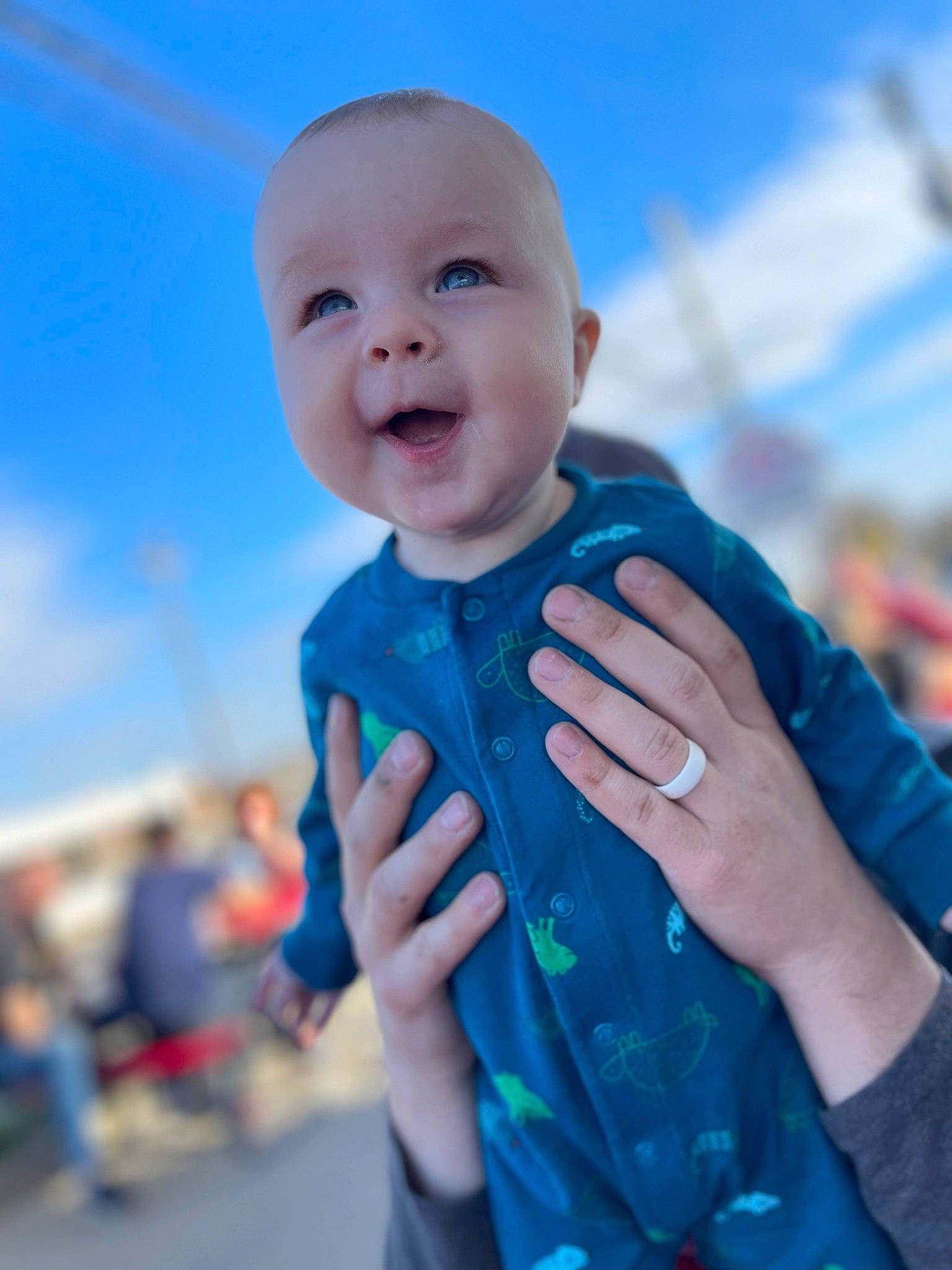 Reid is registered to the contest to win money with this photo: azure, baby, baby_toddler_clothing, blue, child, cloud, electric_blue, event, finger, fun, gesture, happy, leisure, person, recreation, skin, sky, smile, thumb, toddler