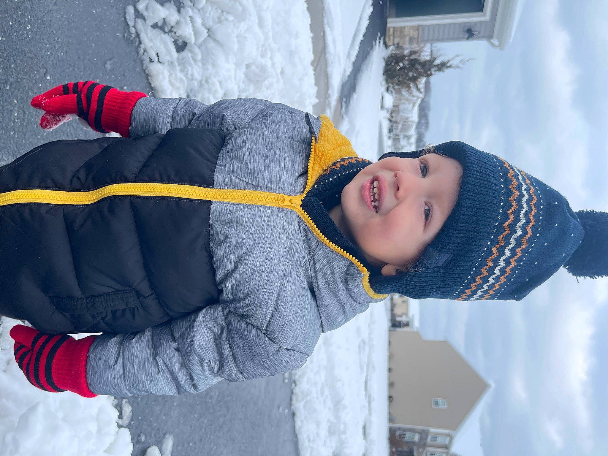 Zain joined the competition — help win amazing prizes! cloud, electric_blue, freezing, fun, glove, headwear, human_body, jacket, outerwear, person, recreation, sky, sleeve, slope, smile, snow, street_fashion, textile, toddler, water