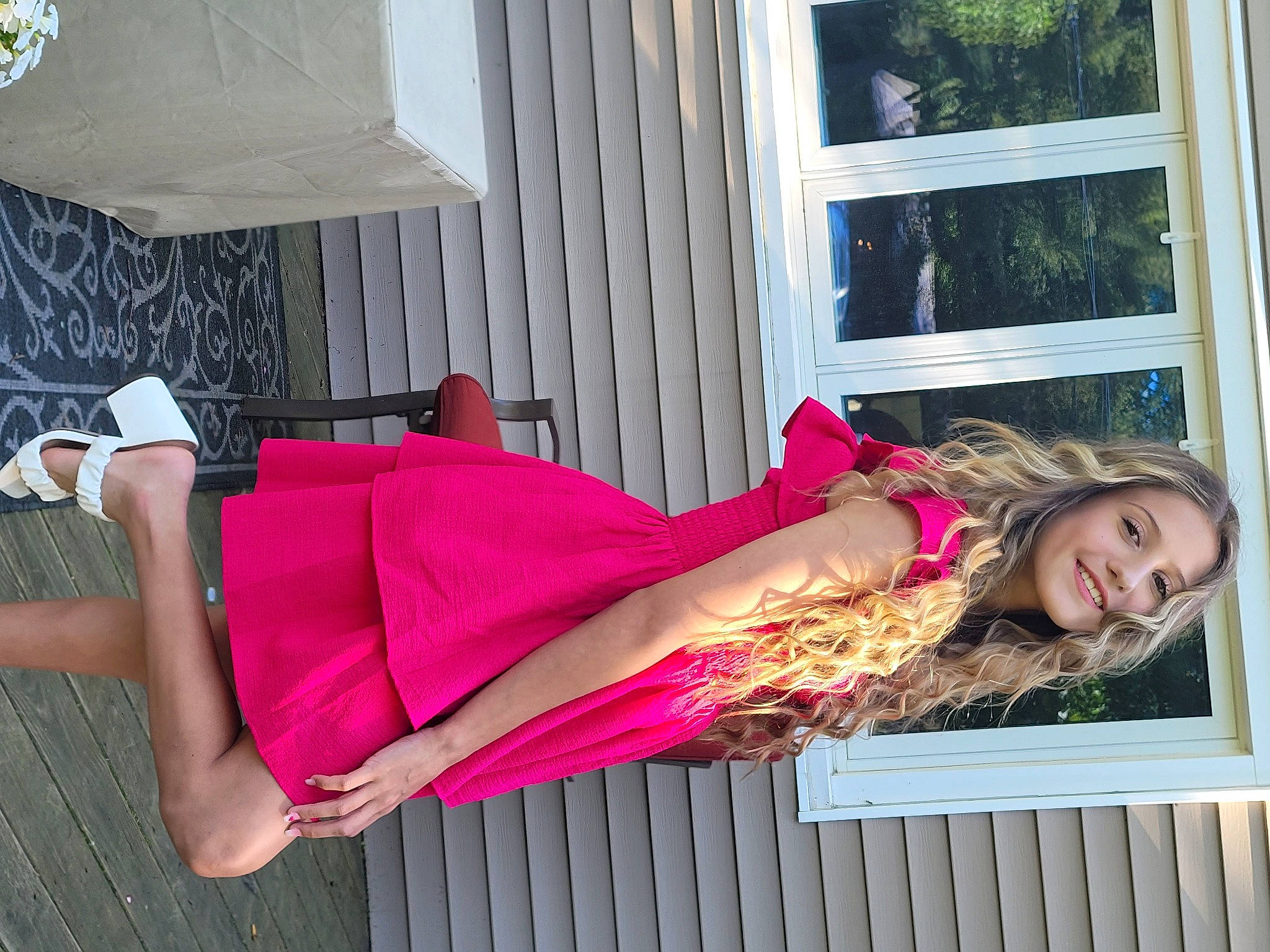 Kyla Roberts is registered to the contest to win money with this photo: clothing, dress, green, happy, hat, human_leg, joy, knee, leg, leisure, magenta, person, pink, purple, sitting, smile, thigh, tree, waist, window