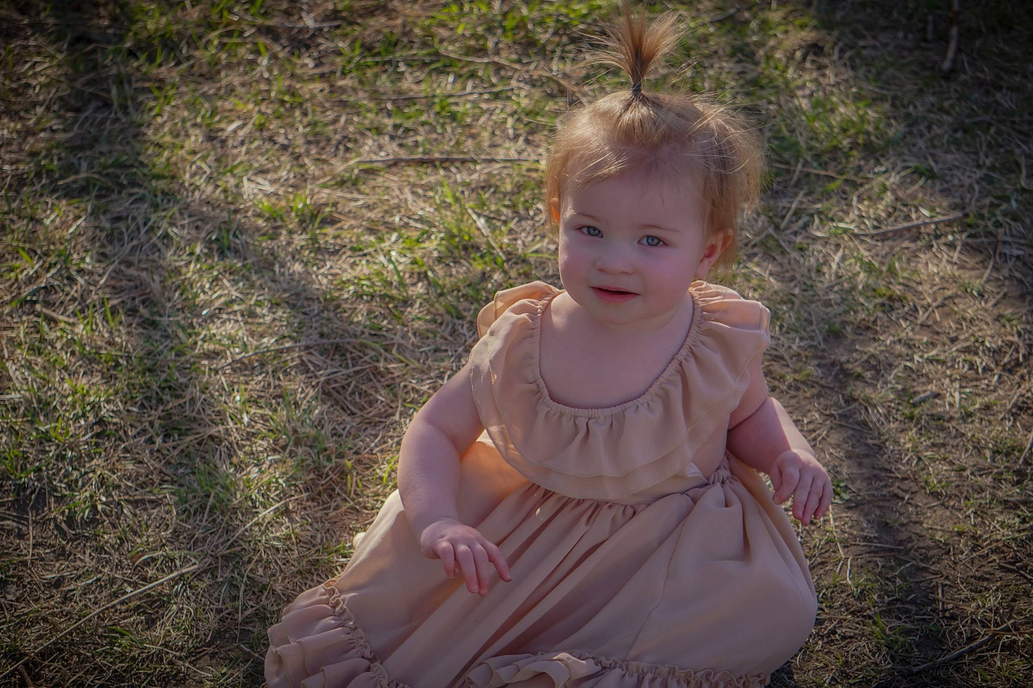 Samantha is registered to the contest to win money with this photo: baby, baby_toddler_clothing, blond, dress, eye, fawn, flash_photography, fun, grass, grass_family, happy, iris, joy, people_in_nature, person, plant, skin, smile, sunlight, toddler