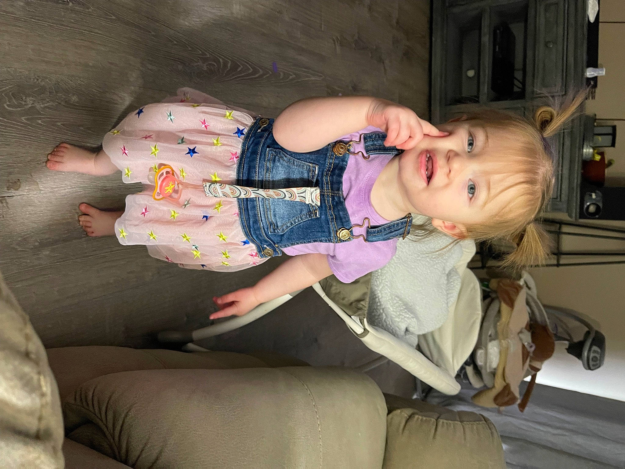Samantha is registered to the contest to win money with this photo: baby, baby_products, baby_toddler_clothing, child, comfort, fun, glasses, human_body, human_leg, knee, lap, leg, pattern, person, room, sitting, smile, sunglasses, thigh, toddler