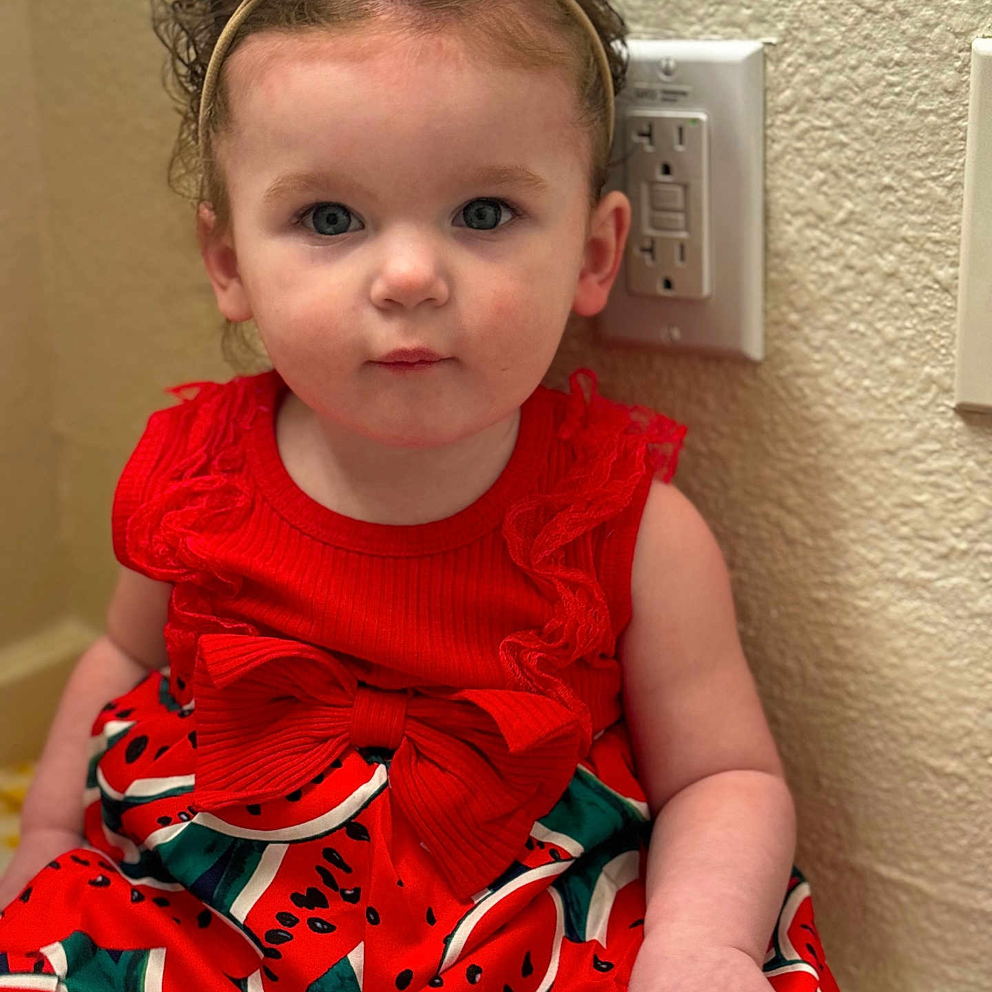 Renesmee is registered to the contest to win money with this photo: accessories, baby, blouse, bodypart, clothing, costume, dress, electricaldevice, face, fashion, finger, formalwear, hand, head, helmet, indoors, person, photography, portrait, sitting