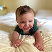 Eli joined the competition — help win amazing prizes! baby, child, smiling, crawling, bed, blanket, hands, face, blue_eyes, infant, cute, soft_light, indoor, young_child, happy, person, skin, hair, clothing, portrait