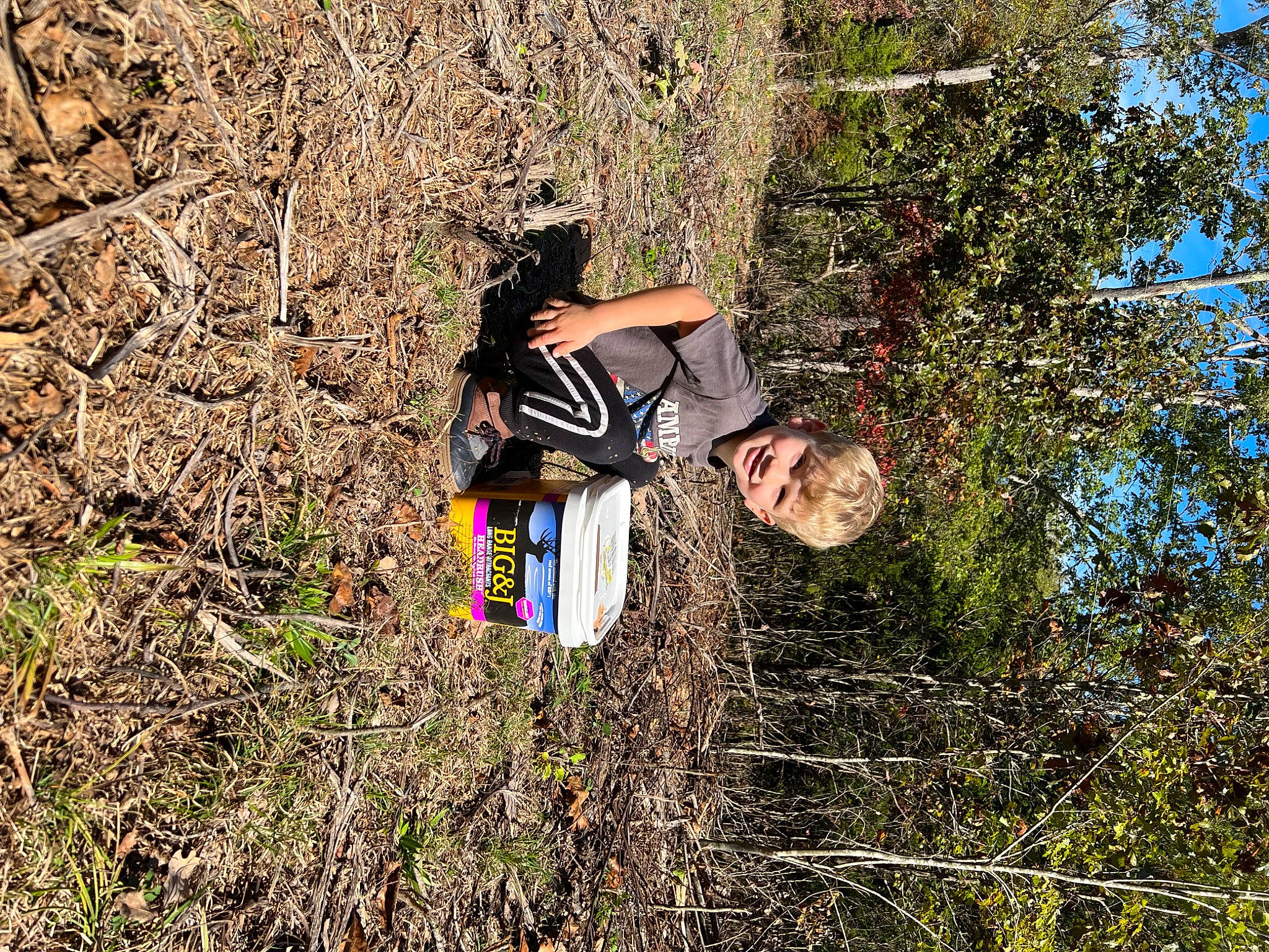 Blayne joined the competition — help win amazing prizes! adventure, bag, branch, forest, fun, grass, grass_family, joy, leisure, luggage_and_bags, people_in_nature, person, plant, plant_community, recreation, shrub, soil, tree, trunk, wilderness