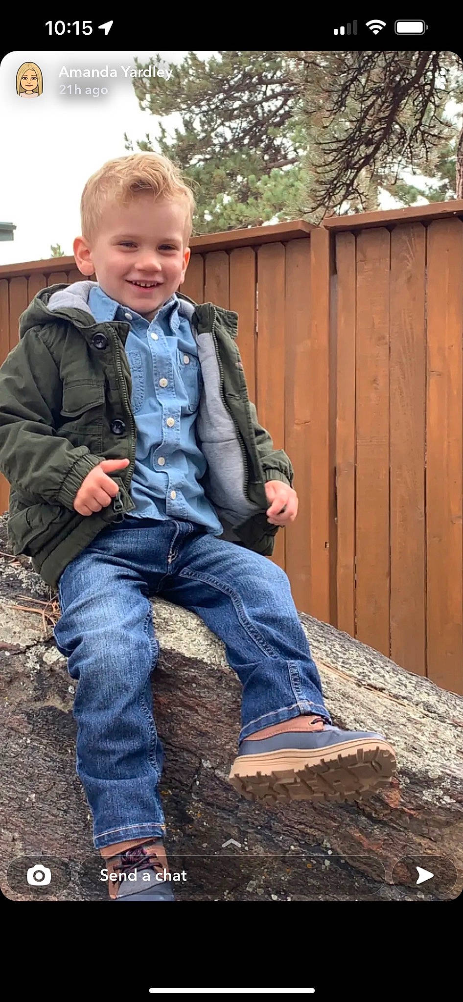 Blayne is registered to the contest to win money with this photo: boot, clothing, denim, dress_shirt, electric_blue, face, fence, flash_photography, footwear, grass, jeans, joy, leg, pattern, person, shoe, sleeve, smile, sneakers, toddler