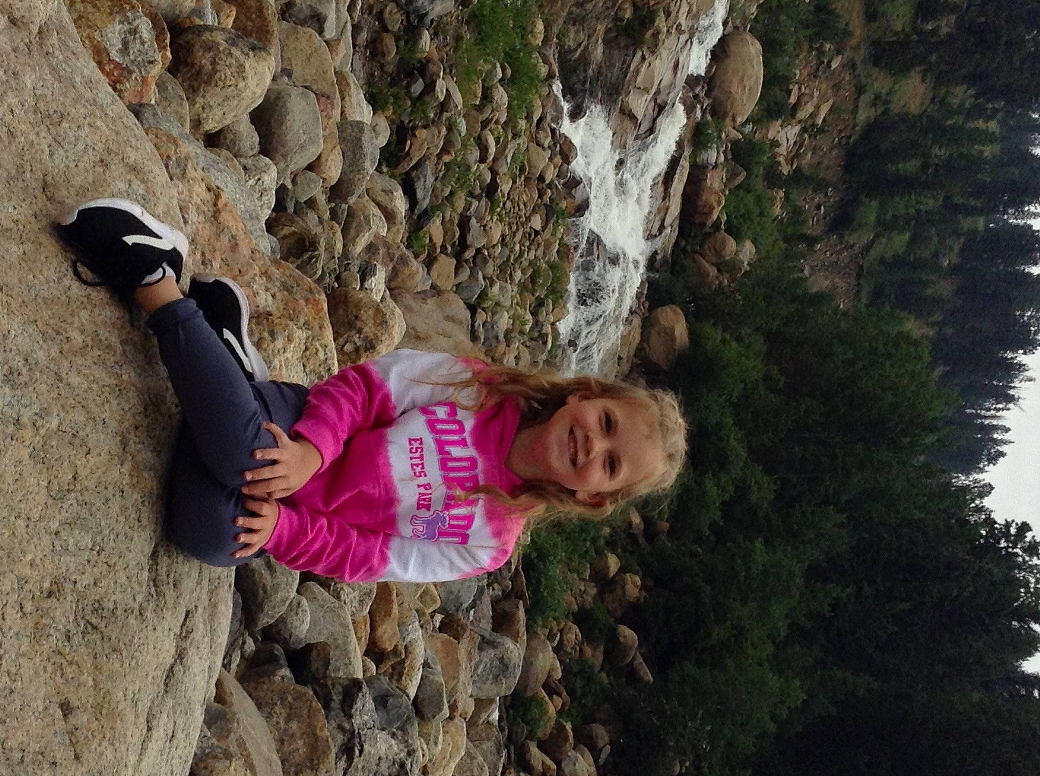 Arianna joined the competition — help win amazing prizes! adventure, bedrock, body_of_water, formation, fun, geology, grass, happy, joy, landscape, leisure, organism, people_in_nature, person, plant, recreation, smile, tree, trunk, wall