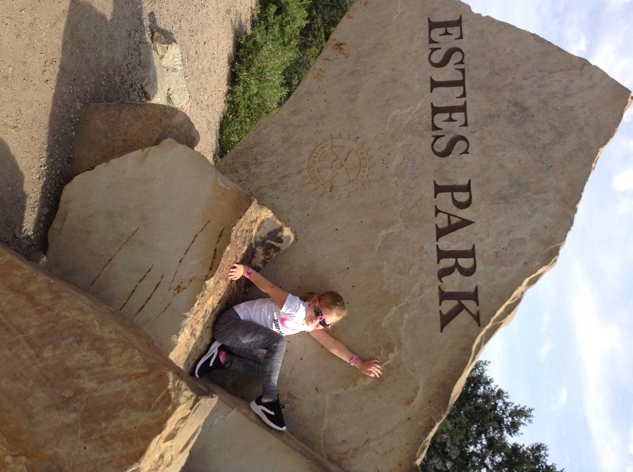 Arianna is registered to the contest to win money with this photo: adventure, art, cloud, concrete, extreme_sport, font, landscape, leisure, line, person, recreation, rock, shadow, signage, sky, sport_climbing, t_shirt, travel, tree