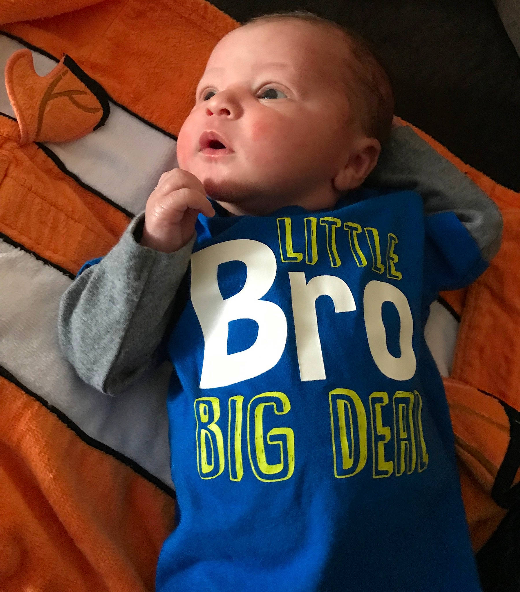 Josiah is registered to the contest to win money with this photo: baby, baby_toddler_clothing, blue, cheek, child, cool, electric_blue, finger, person, sleeve, t_shirt, textile, toddler, world