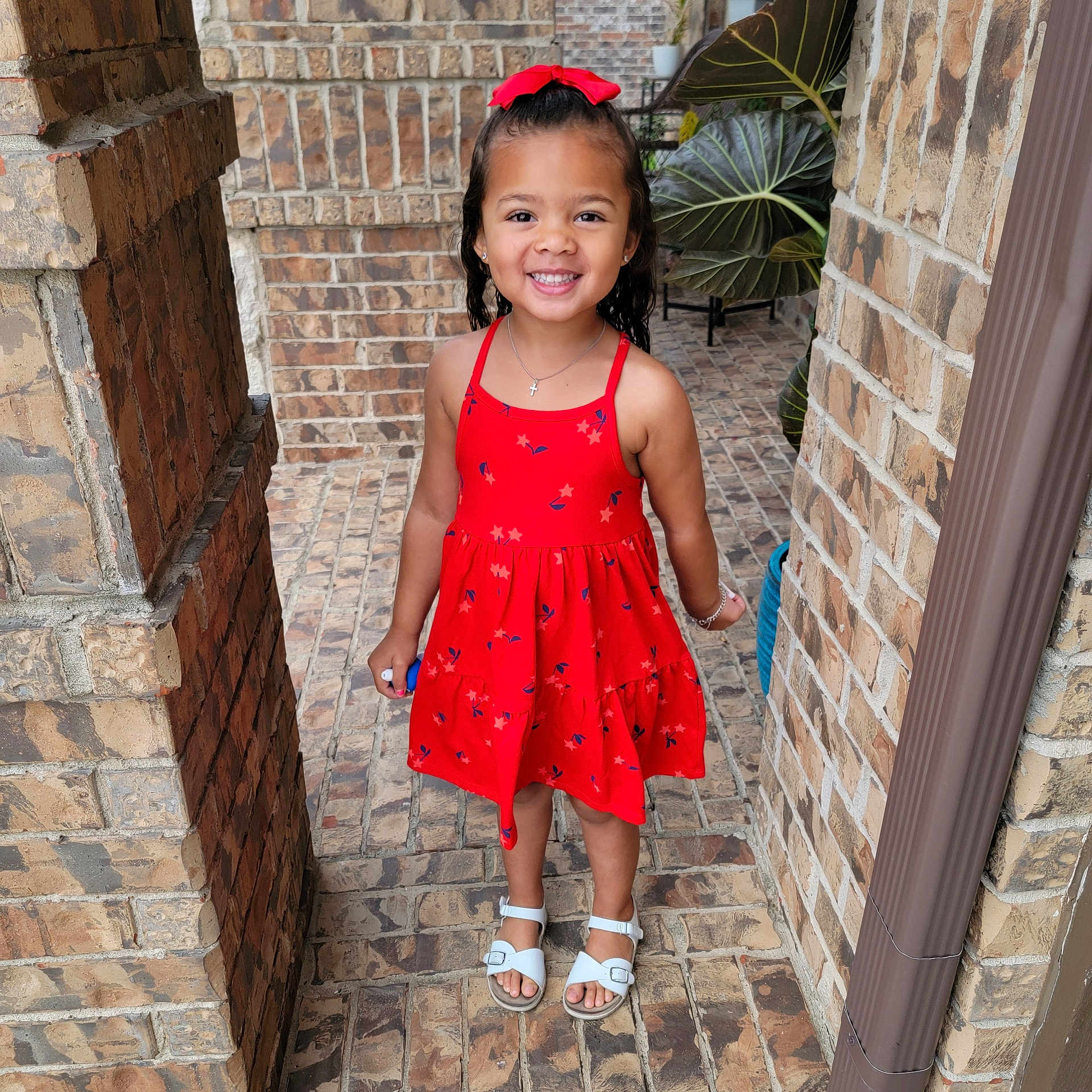 Danae is registered to the contest to win money with this photo: accessories, brick, child, clothing, dress, eveningdress, face, female, flagstone, footwear, formalwear, girl, head, jewelry, path, person, photography, portrait, sandal, walkway