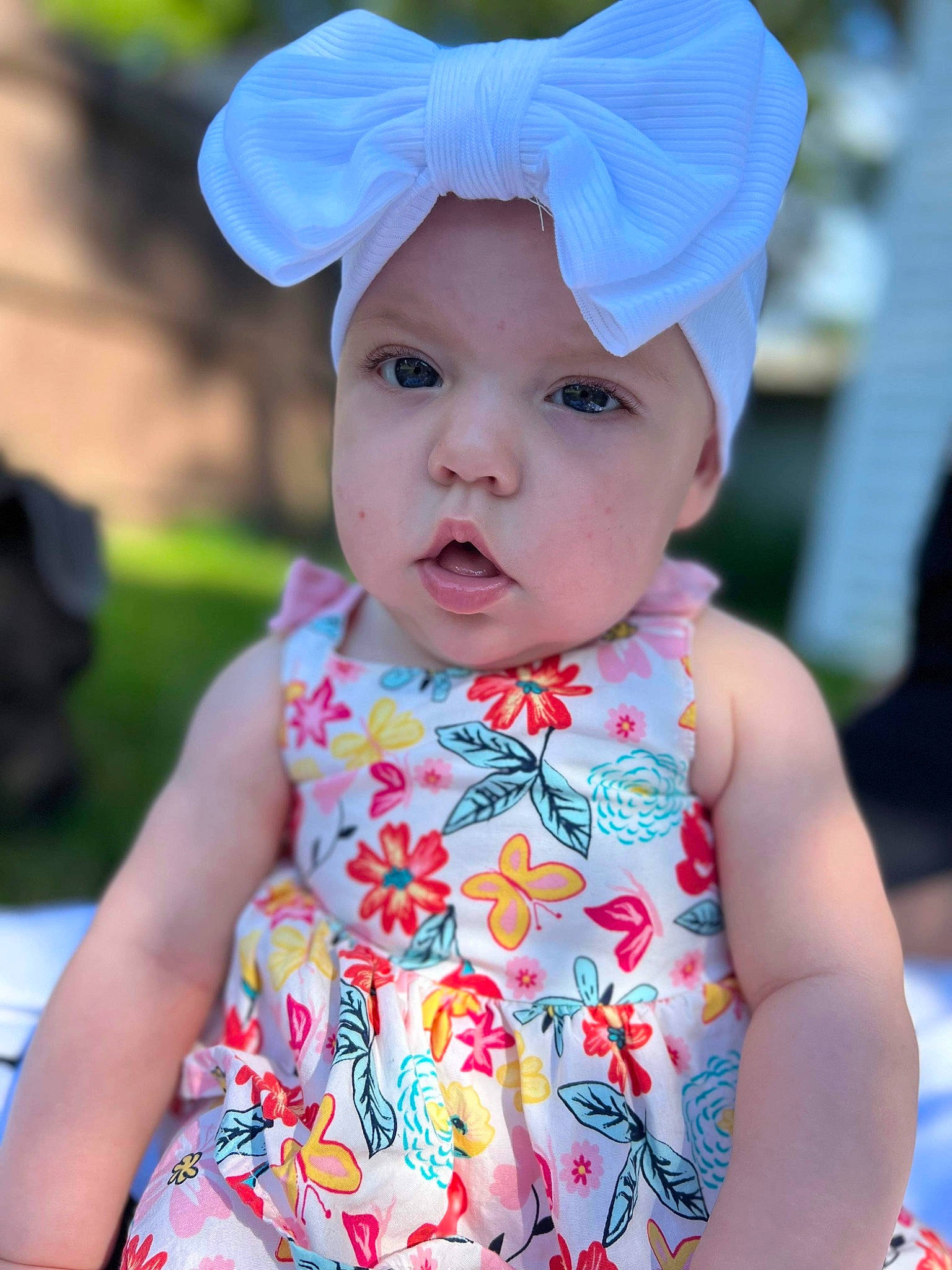 Mya is registered to the contest to win money with this photo: baby, baby_toddler_clothing, beauty, blue, cap, child, costume_hat, dress, eye, grass, happy, hat, head, headwear, person, photograph, pink, skin, sleeve, summer