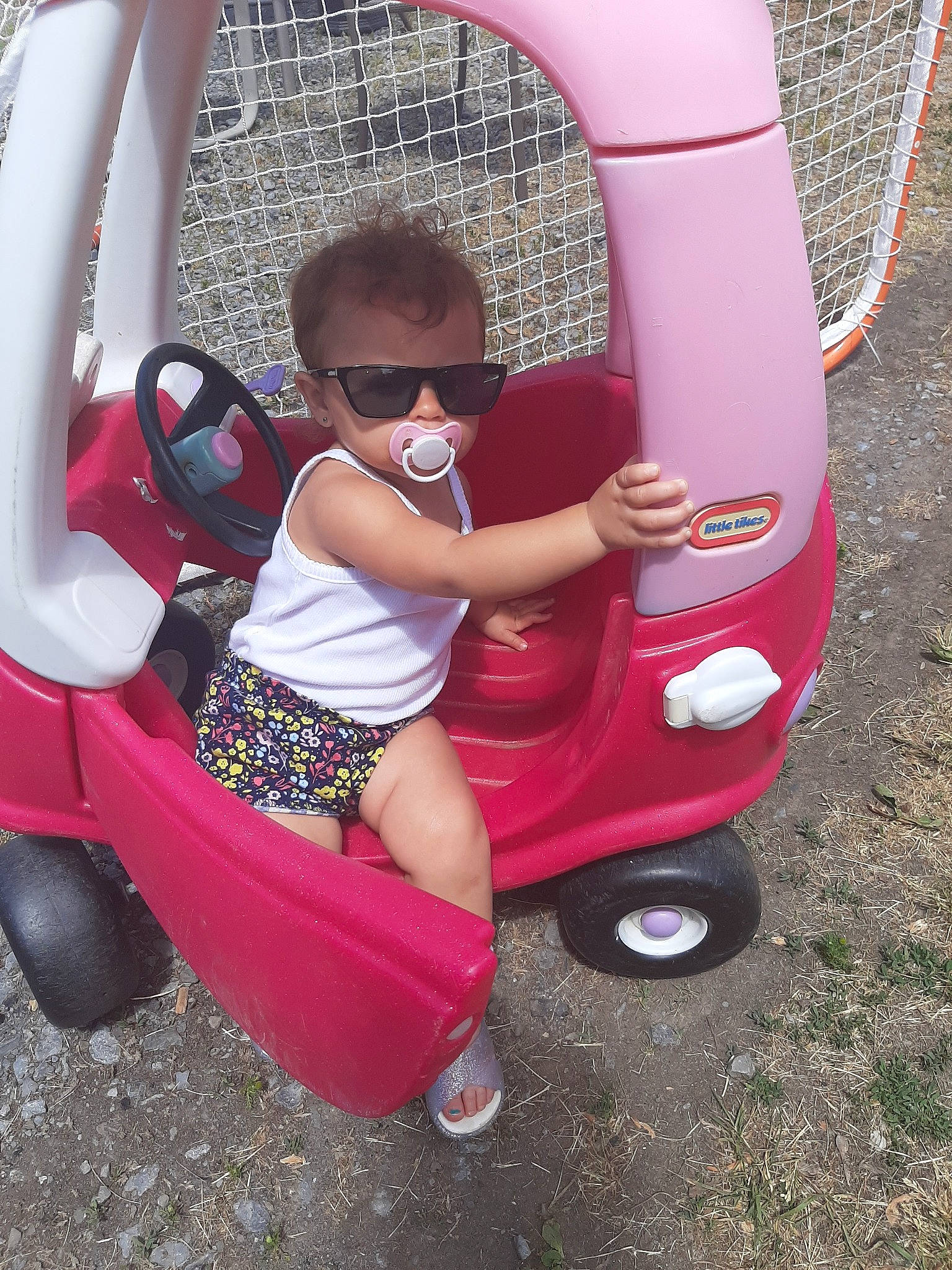 Jazlyn joined the competition — help win amazing prizes! baby_carriage, baby_products, child, fun, leisure, outdoor_play_equipment, person, pink, play, playground, product, public_space, smile, summer, swing, toddler, vacation